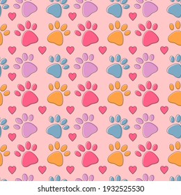 Patrón sin foco con coloridas garras de mascotas. La huella del gato o del perro dibuja un bonito fondo infantil brillante con los corazones rosados. Fondo animal para tienda de mascotas, veterinaria, textil, diseño infantil, papel.