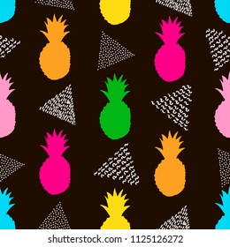 Seamless pattern with colorful pineapples and white triangles on the black background. Vector illustration