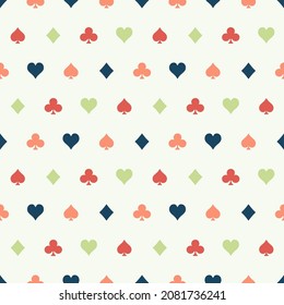 Seamless pattern with colorful playing cards suits