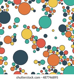 Seamless pattern with colorful polka dots on white background