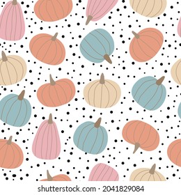 Seamless pattern with colorful pumpkins and dots on white background.