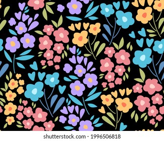 Patrón sin foco con flores y hojas pequeñas y coloridas