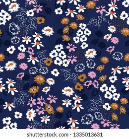 Seamless pattern in colorful small pretty flowers. Liberty style blooming meadow florals design for fashion , fabric , wallpaper , web and all prints on navy blue background color