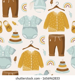 Seamless pattern of colorful spring kids clothes, rainbow, toys leaves in brown and blue colors. Vector illustration.