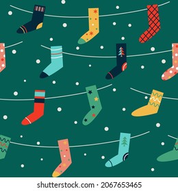 Seamless pattern with colorful stockings. Christmas design for fabric and paper, surface textures.