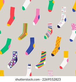 Seamless pattern with colorful trendy socks. Wool, cotton warm accessories with modern patterns. Unisex clothes. Flat style vector illustration