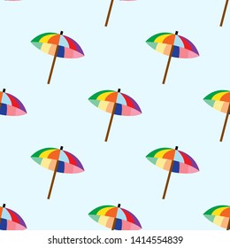 Seamless pattern with colorful umbrellas on blue background
