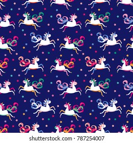 Seamless pattern. A colorful unicorns flies through the blue starry sky.