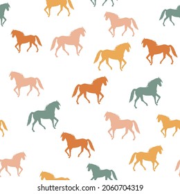 Seamless pattern with colorful walking horses silhouettes on white background. Vector illustration for baby, kids textile,  fabric. EPS 10