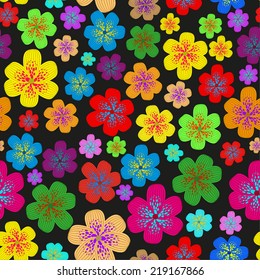 Seamless pattern of colorful wild flowers, randomly distributed, on a black background. Well suited for smart fabrics.