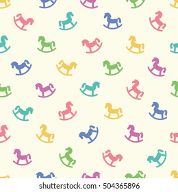 Seamless pattern with coloured rocking-horse