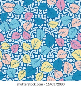 A seamless pattern composed of multi-colored leaves scattered on a texture consisting of four-petalled symbolic flowers.