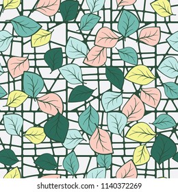 A seamless pattern composed of multicolored leaves scattered on a texture consisting of divided squares.