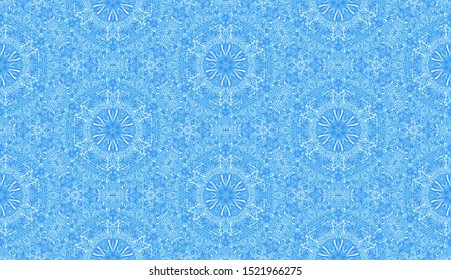 Seamless pattern composed of winter snow pattern. Ice snowflakes in honeycomb. Shades of blue.