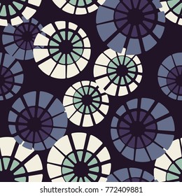 Seamless pattern. Concentric circles are divided into sectors.