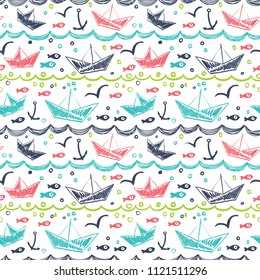 Seamless pattern in the concept of children's drawings. Seamless pattern with ships, fish, sun, clouds, sea and waves.Seamless pattern in the concept of children's drawings. Seamless pattern with ship