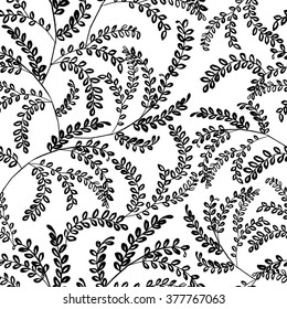 Seamless pattern consisting of black and white plant branches