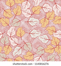 A seamless pattern consisting of chaotically located woody leaves.
The leaves are on the background of the formations of parquet-like slabs.