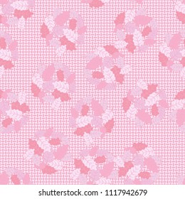 A seamless pattern consisting of groups of multicolored oak leaves. Against the background of the picture there is a network consisting of mutually perpendicular ovals.