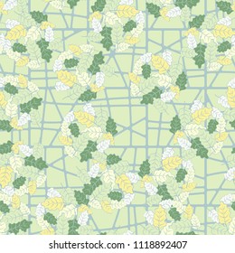 A seamless pattern consisting of groups of multicolored oak leaves. Against the backdrop of the picture is a grille consisting of squares divided into parts.