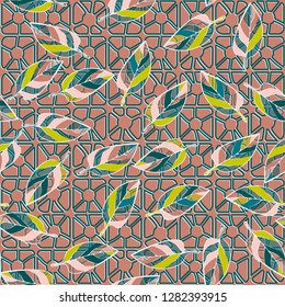 Seamless pattern consisting of motley leaves. Colors of the spring landscape. 
The background texture consists of four-sided pseudoconvex elements. Just for editing.