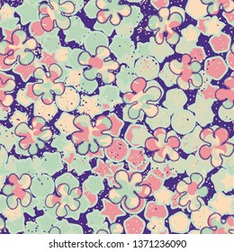 A seamless pattern consisting of painted roughly mottled blots, with a background texture.