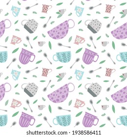 Seamless pattern consisting of tea cups, spoons and tea leaves