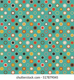 Seamless pattern. Consists of geometric elements having round shape and different color, located on aquamarine background. Useful as design element for texture and artistic compositions.
