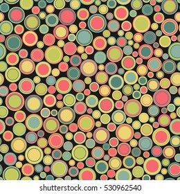 Seamless pattern. Consists of geometric elements having round shape and different color, located on black background. Useful as design element for texture and artistic compositions.