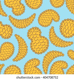 Seamless pattern of cookies biscuits on blue background