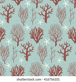 Seamless pattern with corals and starfishes on a blue background