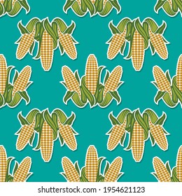seamless pattern of corn cobs isolated on green background