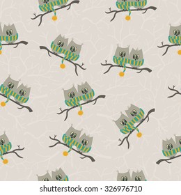 Seamless pattern with couple of owls sitting on a branch. Autumn or winter background. Can be used for backgrounds, fabric prints, scrapbooking, cards, design paper.