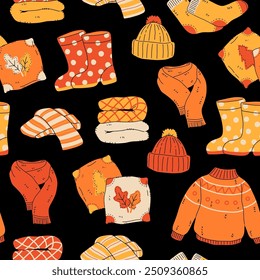 Nahtloses Muster aus gemütlichen herbstlichen Pullovern, Schals, Socken und warmen Accessoires. Herbstbekleidung, Strickjacke, Beanie-Kit. Handgezeichnete, flache Cartoon-Kollektion, Vektorgrafik