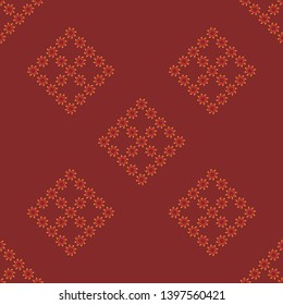 Seamless pattern with cozy ornament of vertical red and orange leaves on brown background. Endless background for your design.