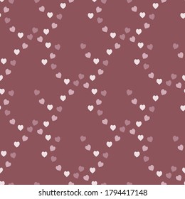 Seamless pattern with cozy pink hearts on discreet dark pink background. Vector image. 