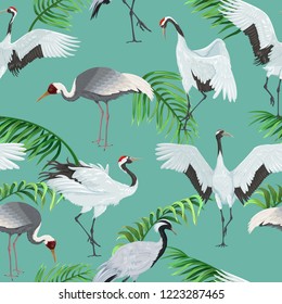 Seamless pattern with cranes and palm leaves