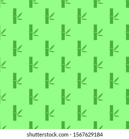Seamless pattern created by silhouette green bamboos set to background