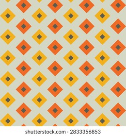Seamless pattern created from small dark khaki diamonds in larger goldi and orange diamonds on a pale green background