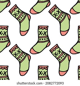 Seamless pattern with creative pink and green socks on white background. Vector image.
