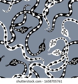 Seamless pattern of creeping decorative black and white snakes