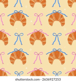 Seamless pattern of croissants and bows. Vector graphics.