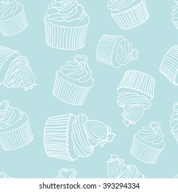 Seamless pattern of cupcakes on a blue background