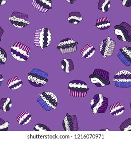 Seamless pattern of cupcakes on a violet, white and black background. Wrapping paper. Vector illustration.