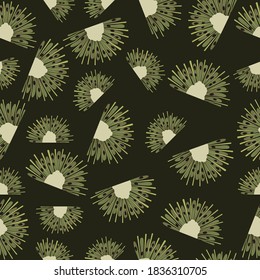 Seamless pattern with cut kiwis on a dark background.