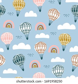 Seamless pattern with cute airballoon,rainbow with hand drawn elements. Great for kids apparel, nursery decoration. Vector Illustration