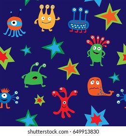 Seamless pattern with a cute aliens on a blue background
