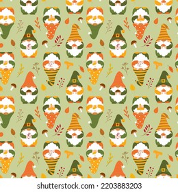 Seamless pattern with cute autumn gnomes holding mushroom, leaves, twigs. Backdrop of forest dwarfs for wrapping paper, wallpaper, textile. Cartoon vector characters on light green background