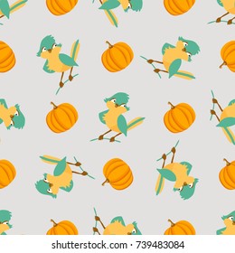 Seamless pattern with cute birds and pumpkins