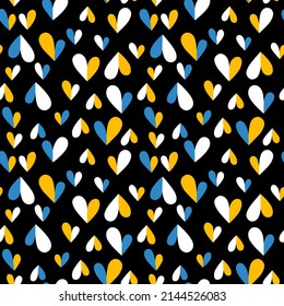 Seamless pattern with cute blue and yellow hearts on black background. Veector illustration.